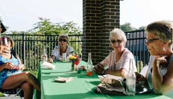 A group of women sitting at a table